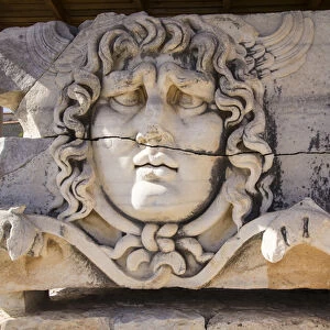 Asia, Turkey, Carved Head of Medusa at the Archaeological Site of Didyma ruins