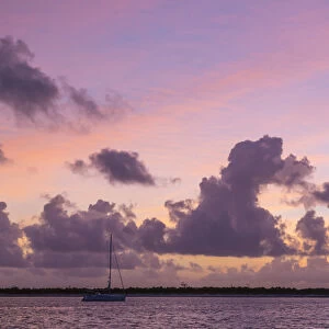 Bahamas, Exuma Island. Sailboat anchored at sunset