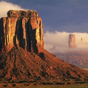 Clouds dance in the buttes in Monument Valley, on the Arizona, Utah border