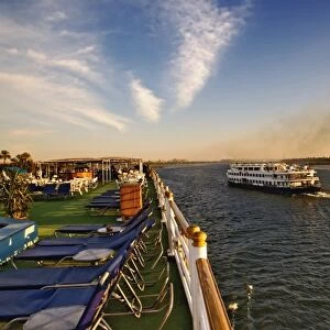 Cruise ships passing on the Nile River, near Aswan, Egypt