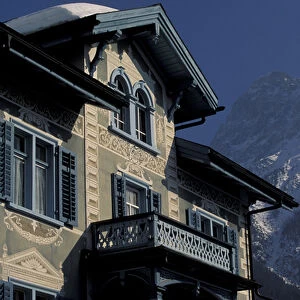 Europe, Switzerland, Graubunden, Scuol. Winter scene of Sgrafitto-ed (Painted) building