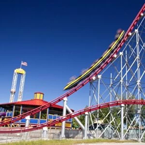 The Mamba roller coaster in motion at Worlds of Fun in Kansas City, Missouri
