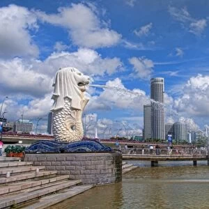 Merlion, symbol of Singapore, and downtown skyline in Fullerton area of Clarke Quay