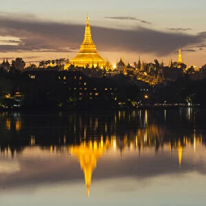 Myanmar, Yangon. Dusk falls on Schwedagon Pagoda