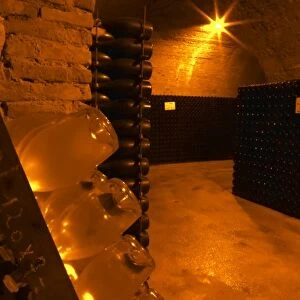 Wine cellar that is an old chalk quarry. A rack (pupitre) with bottles for the prestige