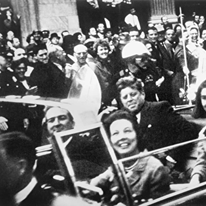 35th President of the United States. Kennedy and his wife, Jacqueline, with Texas Governor John Connally and his wife, Nellie, riding in an open car through Dallas, Texas, shortly before Kennedys assasination on 22 November 1963. Photograph by Victor Hugo King