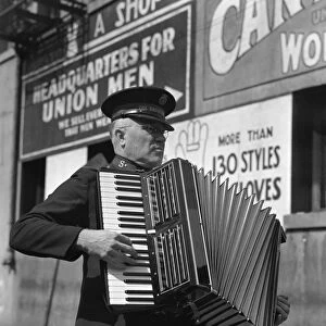 ACCORDION PLAYER, 1939. Salvation Army street band, San Francisco, California