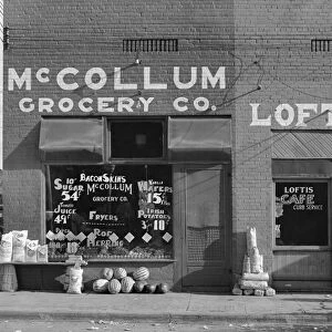 ALABAMA: STOREFRONT, c1935. The McCollum Grocery Company and the Loftis Cafe in Greensboro