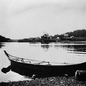 ALASKA: DUGOUT CANOE, c1900. A Tlingit dugout canoe on the shore at Sitka, Alaska