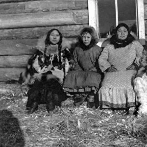ALASKA: ESKIMO FAMILY. An woman identified as Reindeer Mary seated next to her husband
