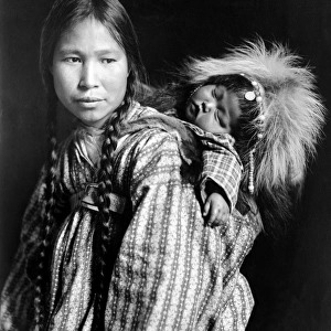 ALASKA: ESKIMOS, c1912. An Inuit woman with a child on her back, Alaska. Photograph