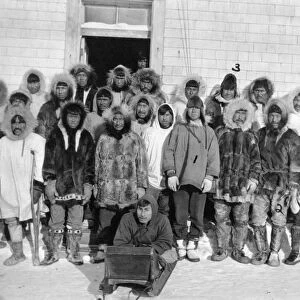 ALASKA: ESKIMOS, c1916. A group of Eskimo men outside of a building, Kivalina, Alaska