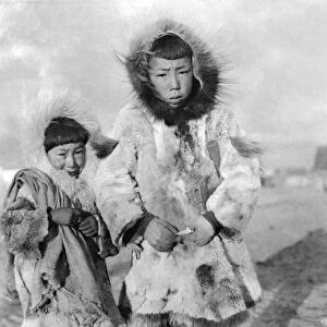ALASKA: ESKIMOS. Two young Eskimo boys dressed in traditional fur clothing, Nome, Alaska
