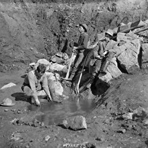 ALASKA: MINING, c1915. Miners panning for gold in Nome, Alaska. Photograph, c1915