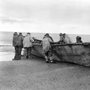 ALASKA: WHALE BOAT, c1929. Native Americans launching a whale boat at Cape Prince of Wales