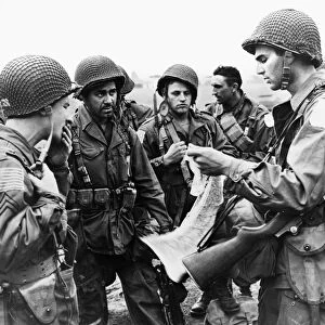 American paratroopers receiving instructions at an airfield in Britain prior to taking part in the air invasion of Holland, 17 September 1944