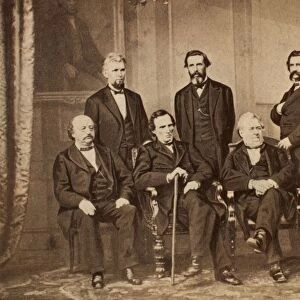 The Andrew Johnson Impeachment Committee, photographed in 1868 by Mathew Brady. Left to right, seated: Benjamin F. Butler, Thaddeus Stevens, Thomas Williams, John A. Bingham. Standing: James F. Wilson, George S. Boutwell, John A. Logan