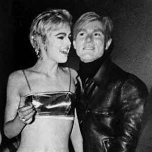 ANDY WARHOL (1928-1987). American artist and filmmaker. Photographed in 1965 with one of his stars, actress and model Edie Sedgwick