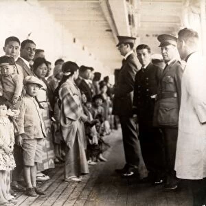 ANGEL ISLAND, 1931. Immigration officials examining Japanese passengers aboard