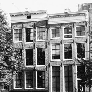 ANNE FRANK HOUSE. The Anne Frank House (left) at 263 Prinsengracht, Amsterdam, where the German Jewish diarist and her family hid from the Germans during World War II. Photographed c1970