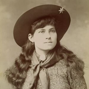 ANNIE OAKLEY (1860-1926). American markswoman: photograph, c1890