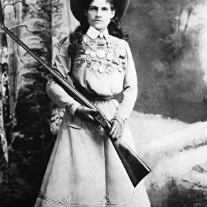 ANNIE OAKLEY (1860-1926). American markswoman. Photographed in 1899