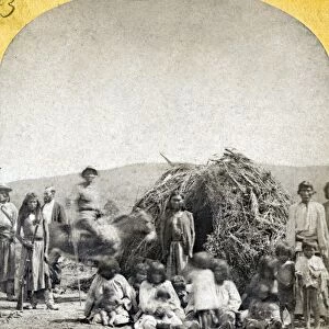APACHE CAMP, c1873. Group of Coyotero Apaches outside their wickiups near Camp Apache, Arizona