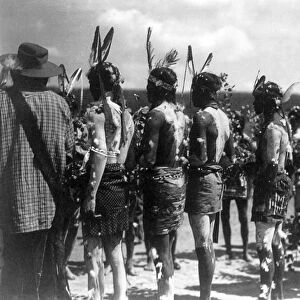 APACHE CEREMONY, c1905. Group of Apache men wearing feathered headbands and body