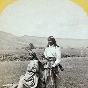 APACHE COUPLE, c1873. A young Apache warrior and his wife, near Camp Apache, Arizona