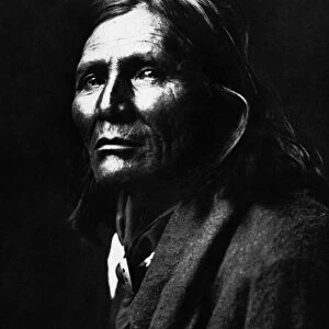 APACHE MAN, 1906. Alchise, an Apache Native American man. Photographed by Edward S