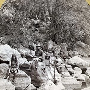 APACHE SCOUTS, 1873. Three Apache scouts on Apache Lake in the Sierra Blanca (White) Mountains