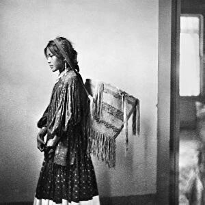 APACHE WOMAN, c1902. A young Apache woman carrying a basket. Photograph by Carl Werntz, c1902