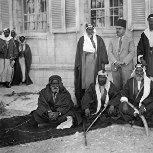 AREF AL-AREF (1892-1973). Palestinian journalist, historian and politician. El-Aref (standing, center) with a group of Bedouin sheikhs, c1935