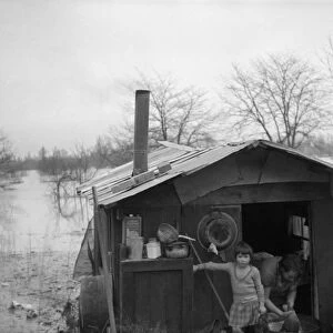 ARKANSAS: FLOOD, 1937. A family aboard their homemade ark in Marianna, Arkansas