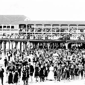 ATLANTIC CITY: BEACH. A large crowd of people posed on and in front of the Steel