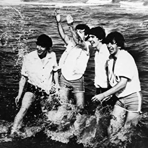THE BEATLES, 1964. The Beatles playing in Lake Erie during a trip to Cleveland, Ohio to play a concert, 1964. Left to right: John Lennon, Paul McCartney, George Harrison and Ringo Starr
