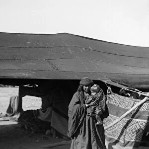 BEDOUIN WOMAN & CHILD. A Bedouin mother and child. Photograph, c1910