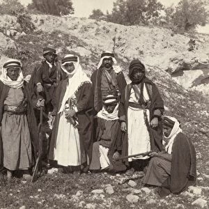 BEDOUINS, c1905. Group of bedouin men, some armed with rifles, swords and knives