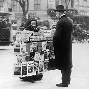 BERLIN: NEWSPAPER SELLER. A woman selling newspapers on the street in Berlin, Germany