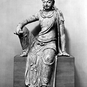 The bodhisattva Guanyin in the royal ease position. Wood with traces of polychrome. Height: 43 in. Sung Dynasty, 10th-11th century
