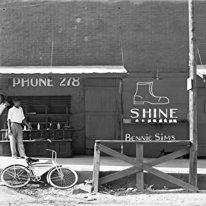 BOOTBLACK STAND, 1936. A shoeshine stand in the southeast