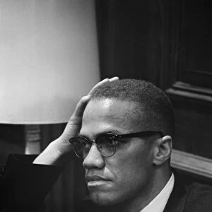 Born Malcolm Little. American religious and political leader. Photographed by Marion Trikosko while waiting at a press conference given by Dr. Martin Luther King, Jr. in Washington, D. C. 26 March 1964