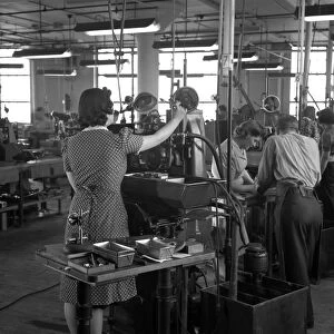 BOSTON: FACTORY, 1942. Estelle Wilson working in a Gillette factory converted to