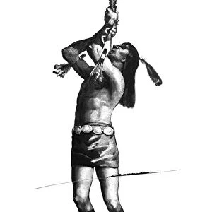 BROOKE: NAVAJO DANCER. A Navajo dancer swalling the great plumed arrow during a