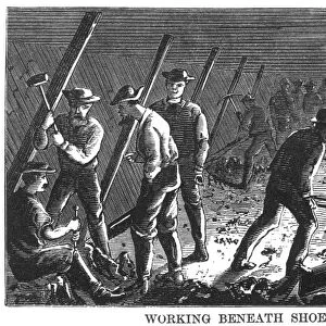 BROOKLYN BRIDGE: CAISSON. Laborers in the caisson at the Brooklyn end of the bridge. Wood engraving, American, 1870