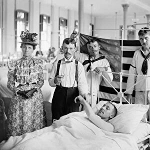 BROOKLYN: HOSPITAL, c1900. A doctor taking a patients pulse at the Brooklyn Navy