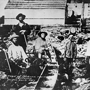 CALIFORNIA GOLD RUSH. White and Chinese prospectors at Auburn Ravine in the Sierra