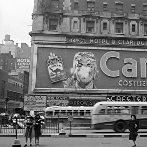 CAMEL ADVERTISEMENT, 1943. A billboard for a Camel cigarette advertisement in Times Square