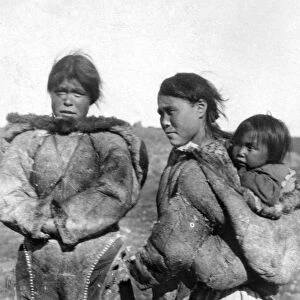 CANADA: ESKIMOS, c1927. Two Eskimo women, one carrying a child on her back