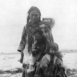 CANADA: ESKIMOS. An Eskimo mother standing outside with her young daughter